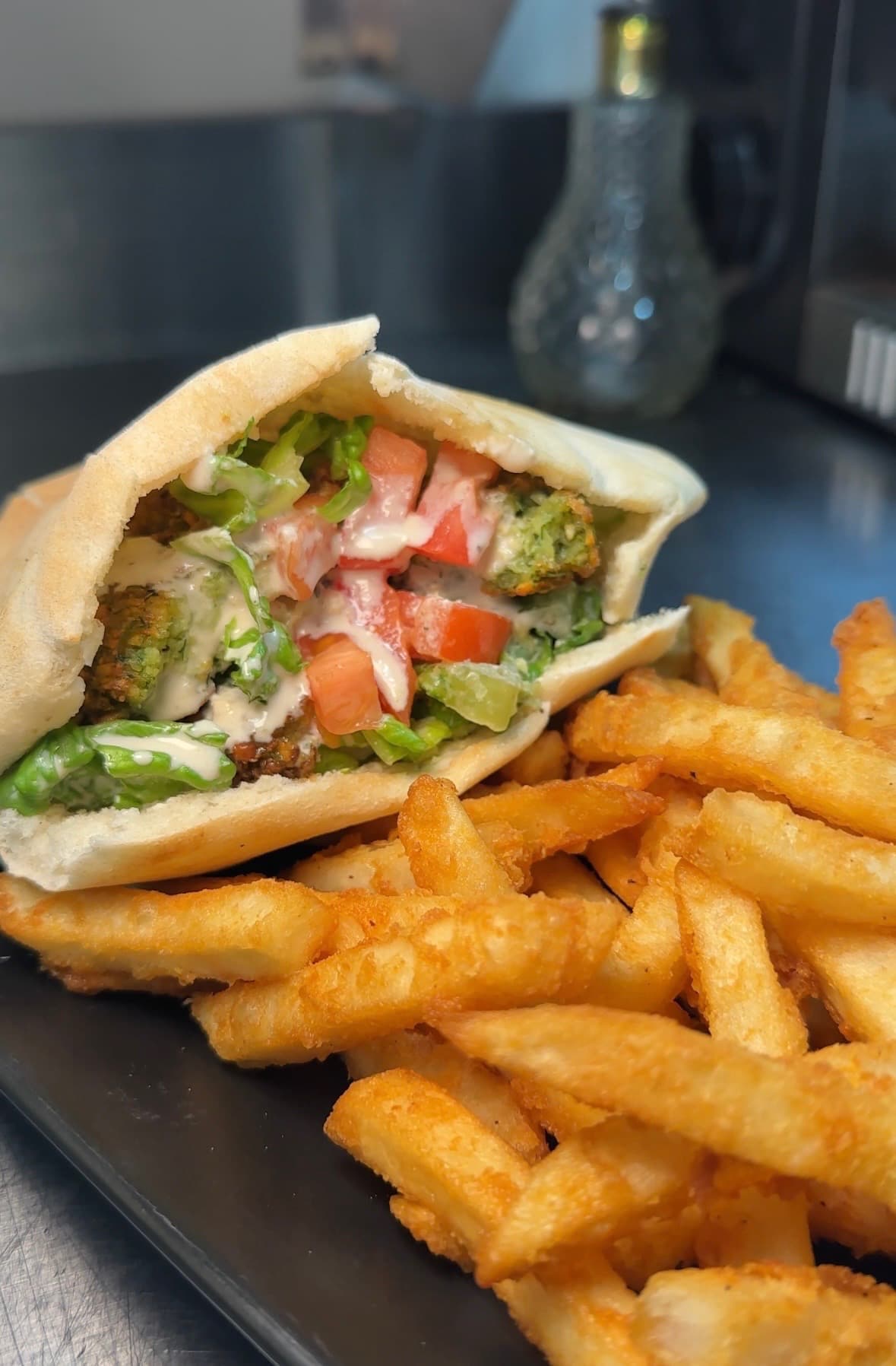 Egyptian style falafel sandwich stuffed in a pita pocket